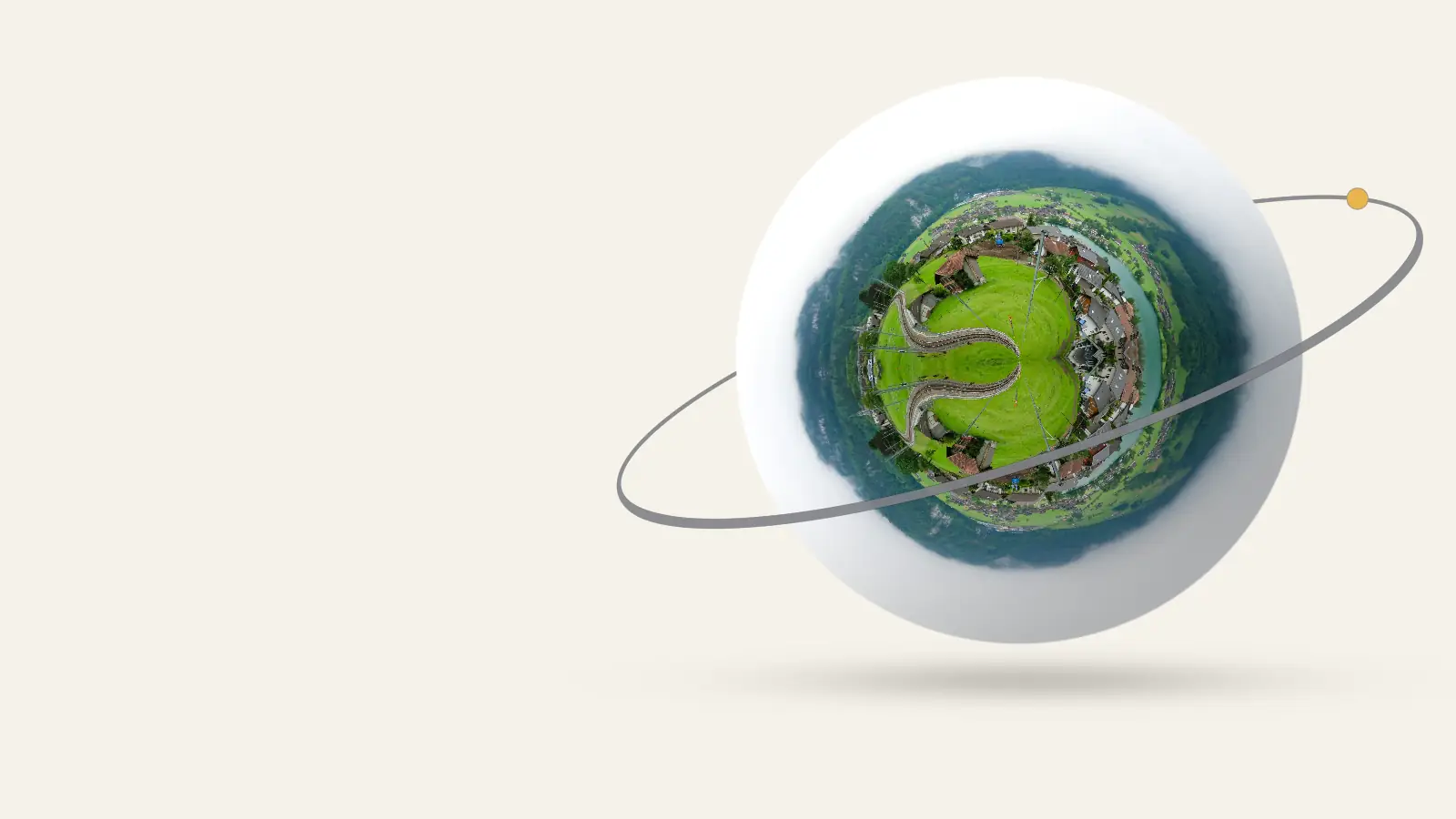 Europe as a little planet: Beautiful shot of Lungern village in Switzerland with lush green hills and railway. Misty mountains in the backdrop