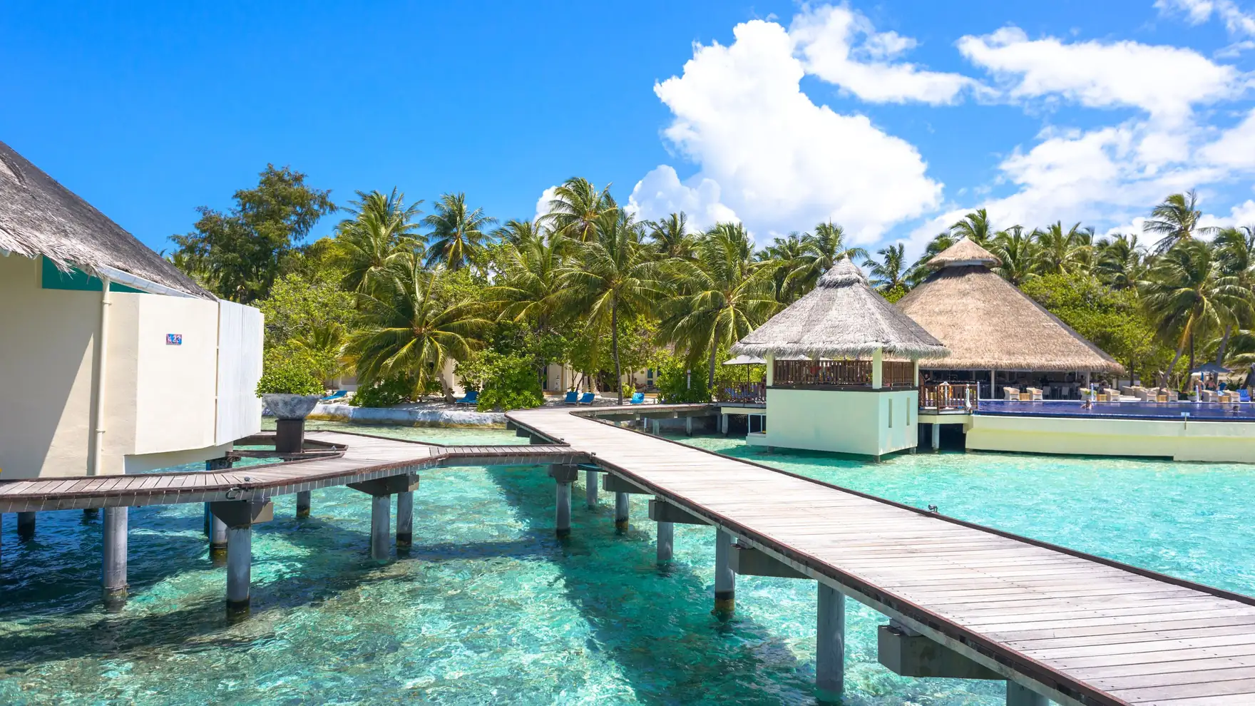 Explore tropical paradise with stunning overwater bungalows and crystal-clear waters in the Maldives