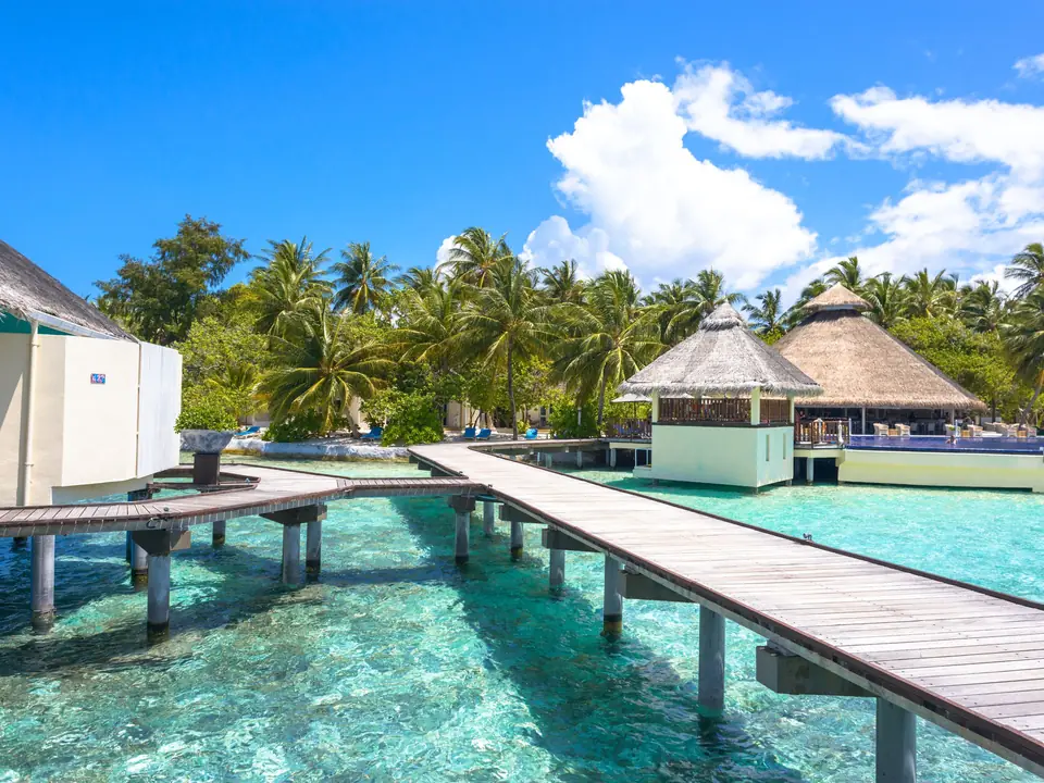 Explore tropical paradise with stunning overwater bungalows and crystal-clear waters in the Maldives