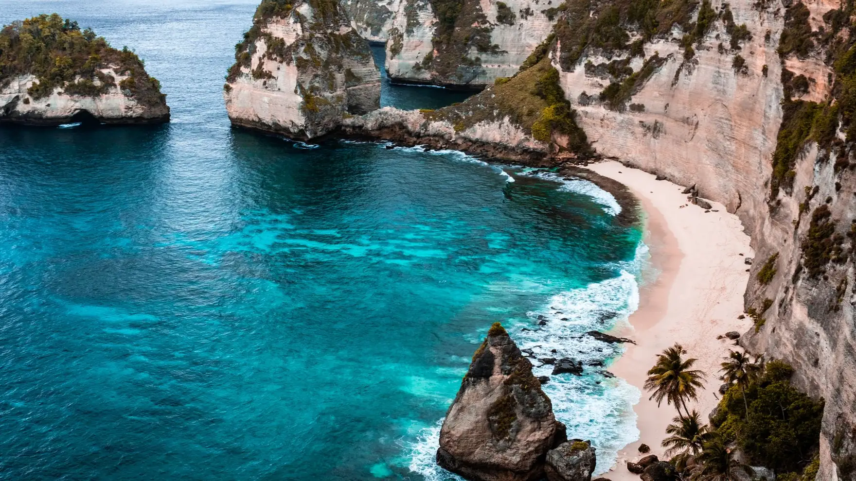 A breathtaking view of Nusa Penida's turquoise waters and rocky cliffs in Bali, Indonesia